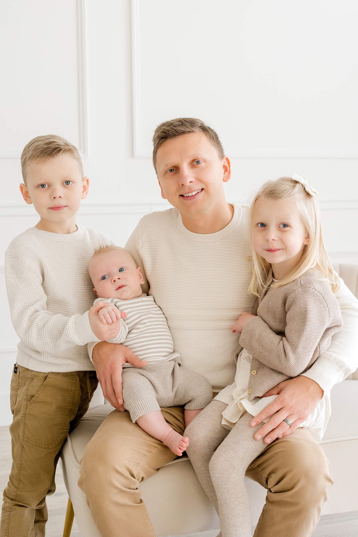 Family smiles for in-studio photos