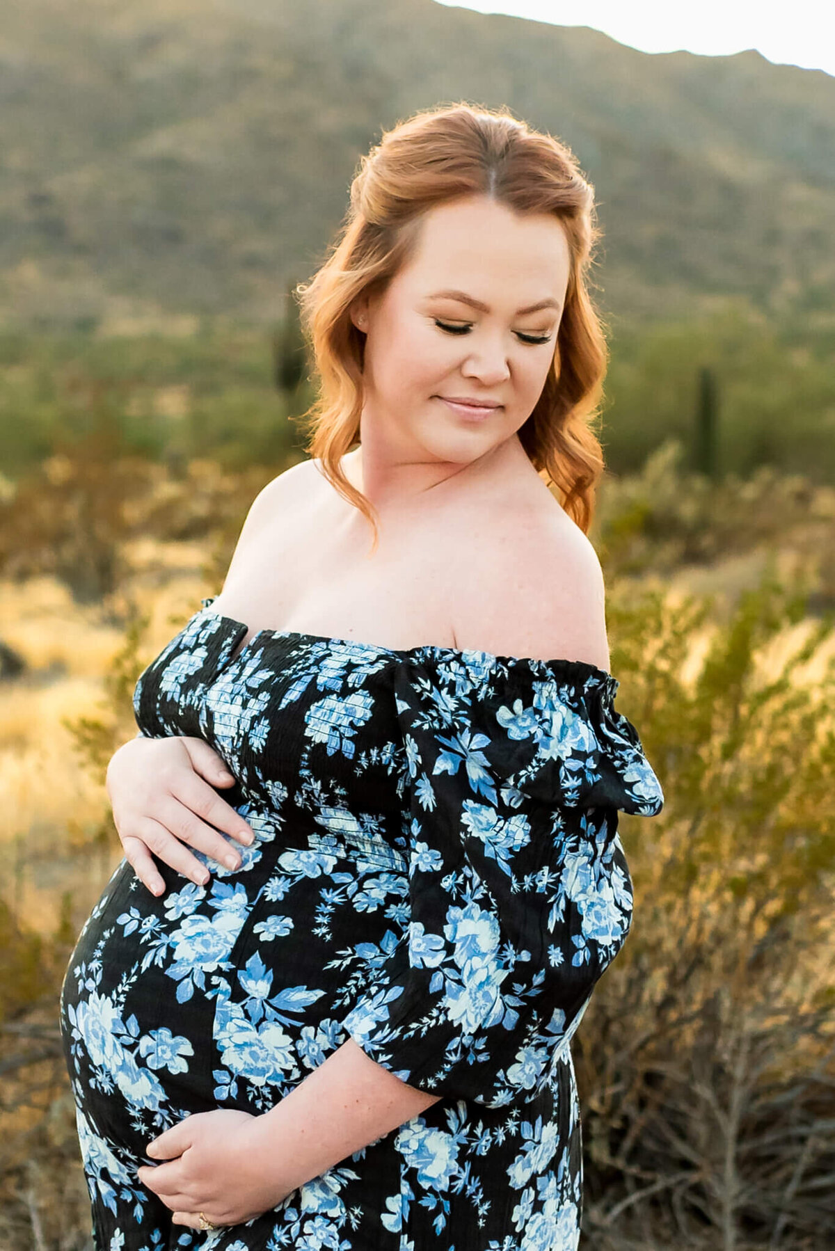 glowing pregnant Arizona mom posed by Cactus & Pine Photography