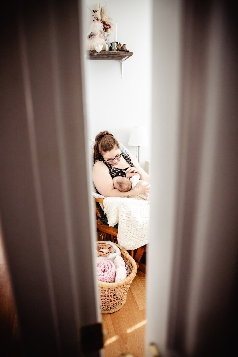 A new mom breastfeeds her two day old baby in her Edmonton home