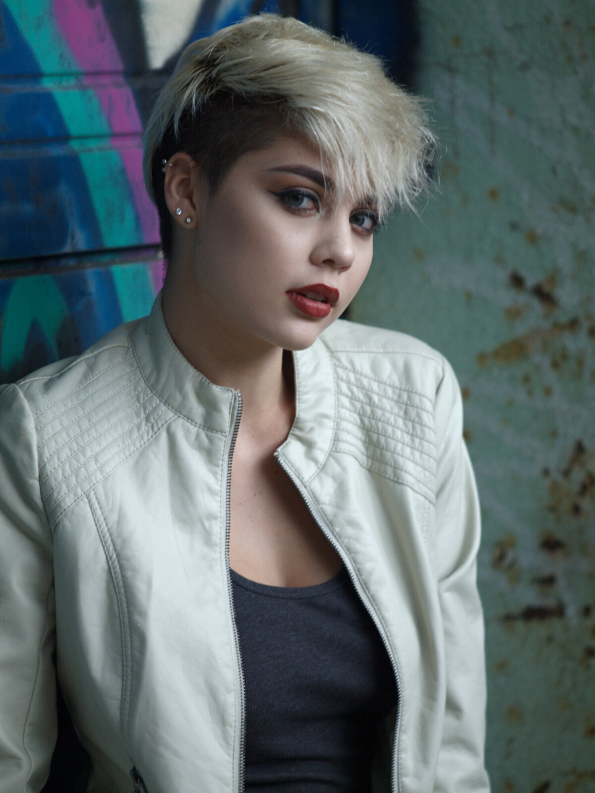 girl with graffiti outdoor daytime portrait