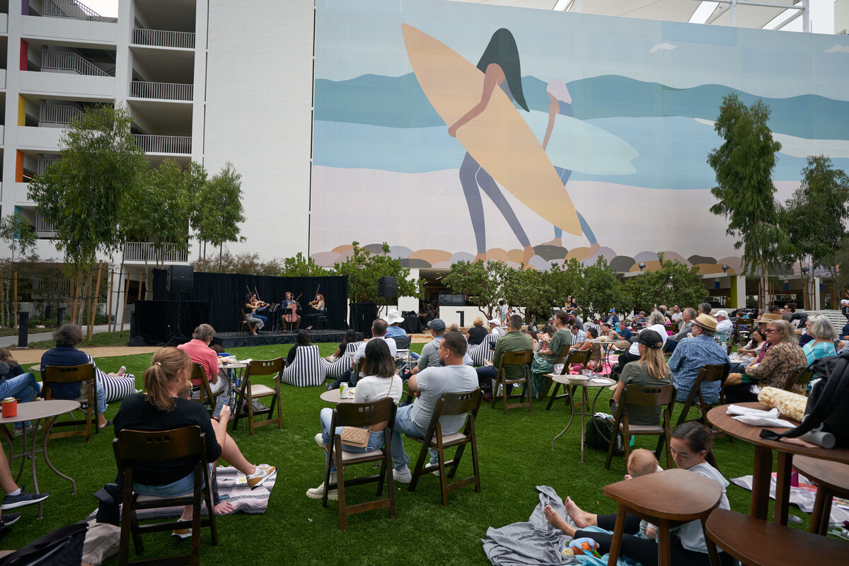a family friendly outdoor concert at one paseo