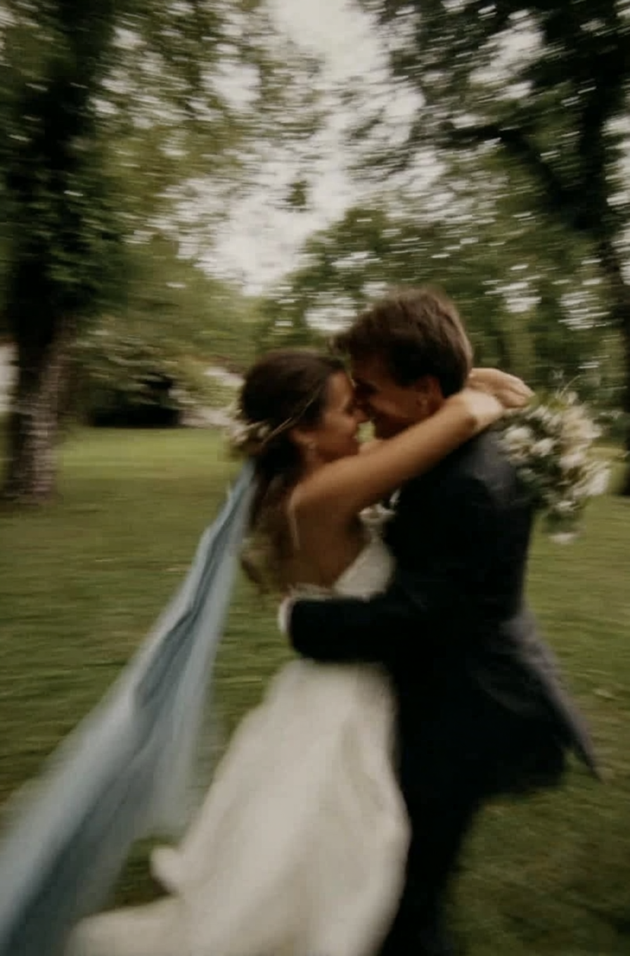 u8487914977_a_bride_and_groom_hugging_in_the_park_the_wedding_95ab046c-8329-469e-afe9-f492741dc0e0_3