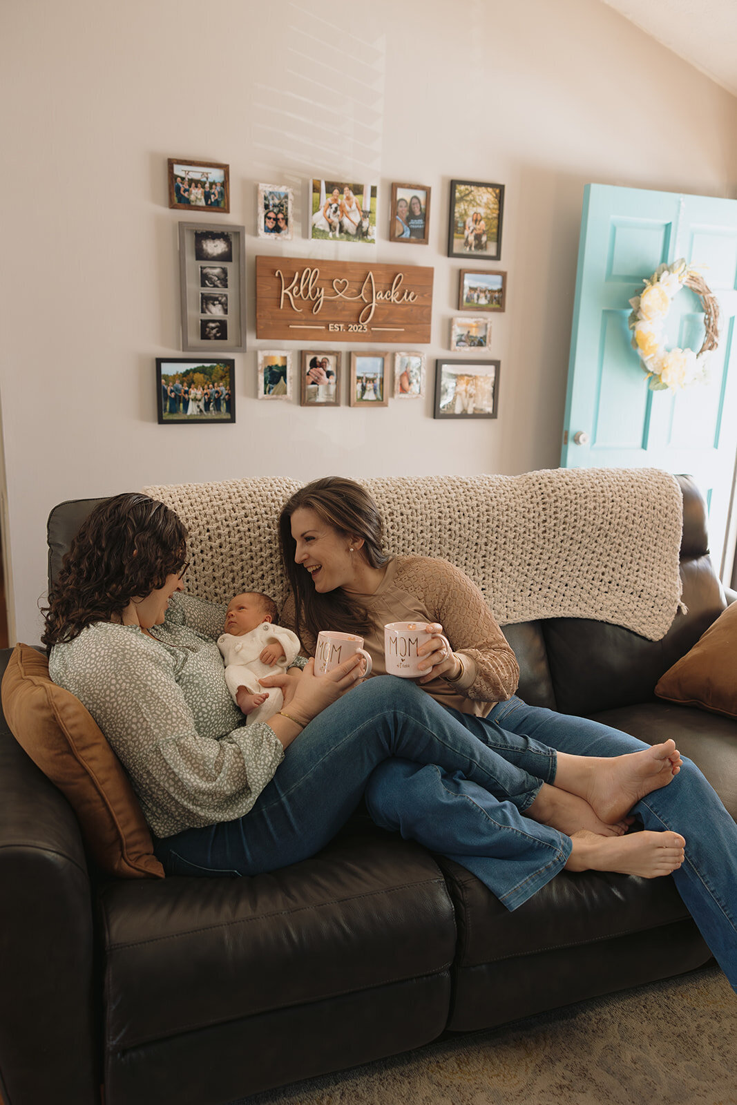 Couple posing in their home during their newborn session with RVA newborn photographer, Three Bridge Photography