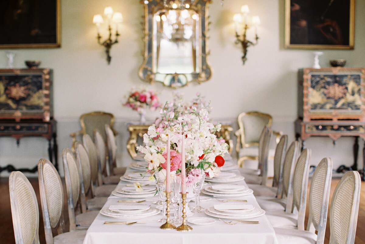 luxury intimate wedding table setting with red and pink flowers