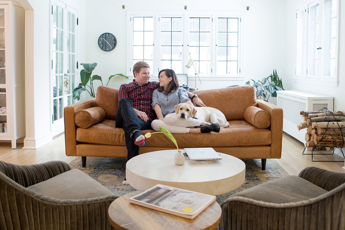 couple_with_dog_in_living_room
