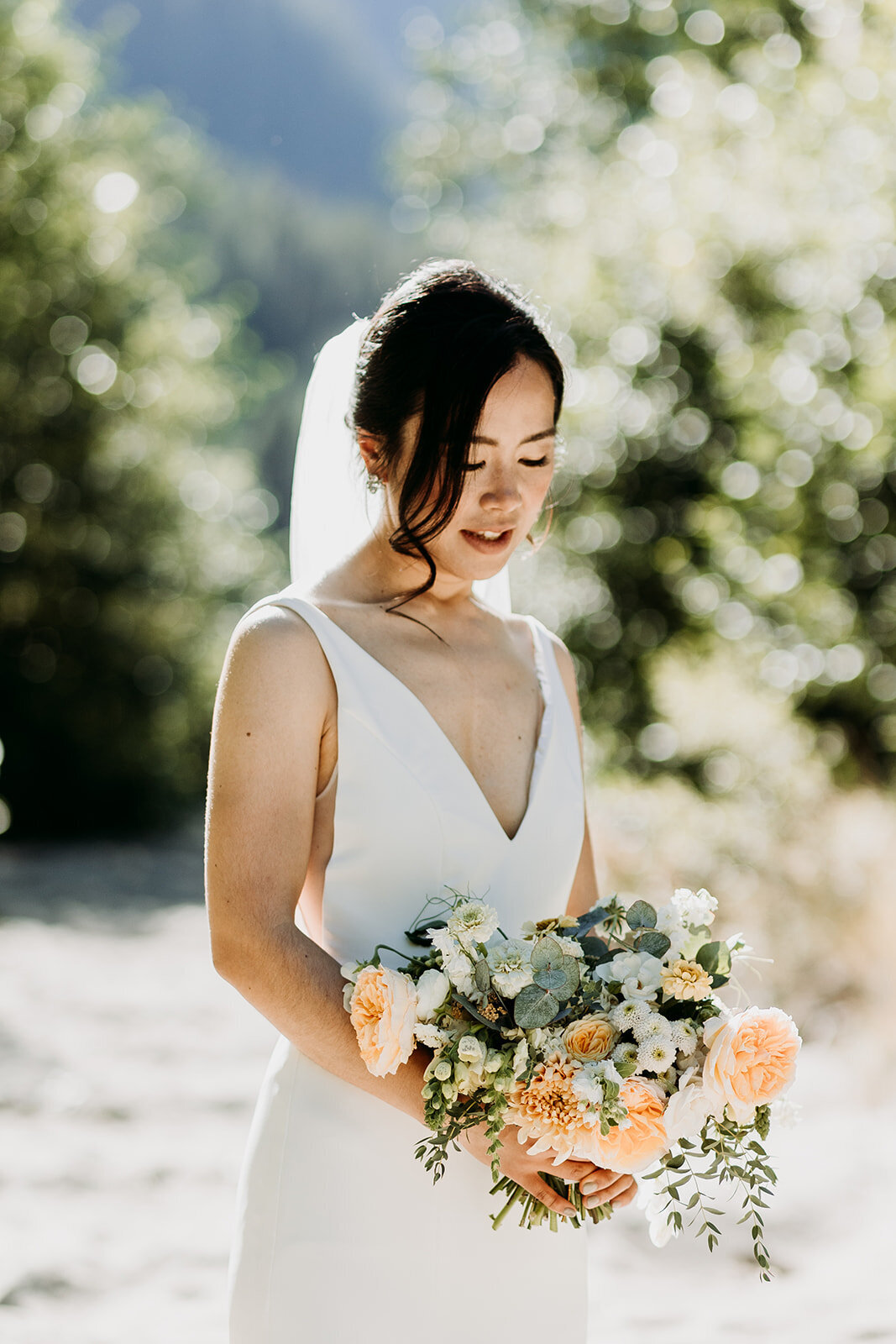 bride holding custom floral bouquet for Squamish wedding - Within the Flowers
