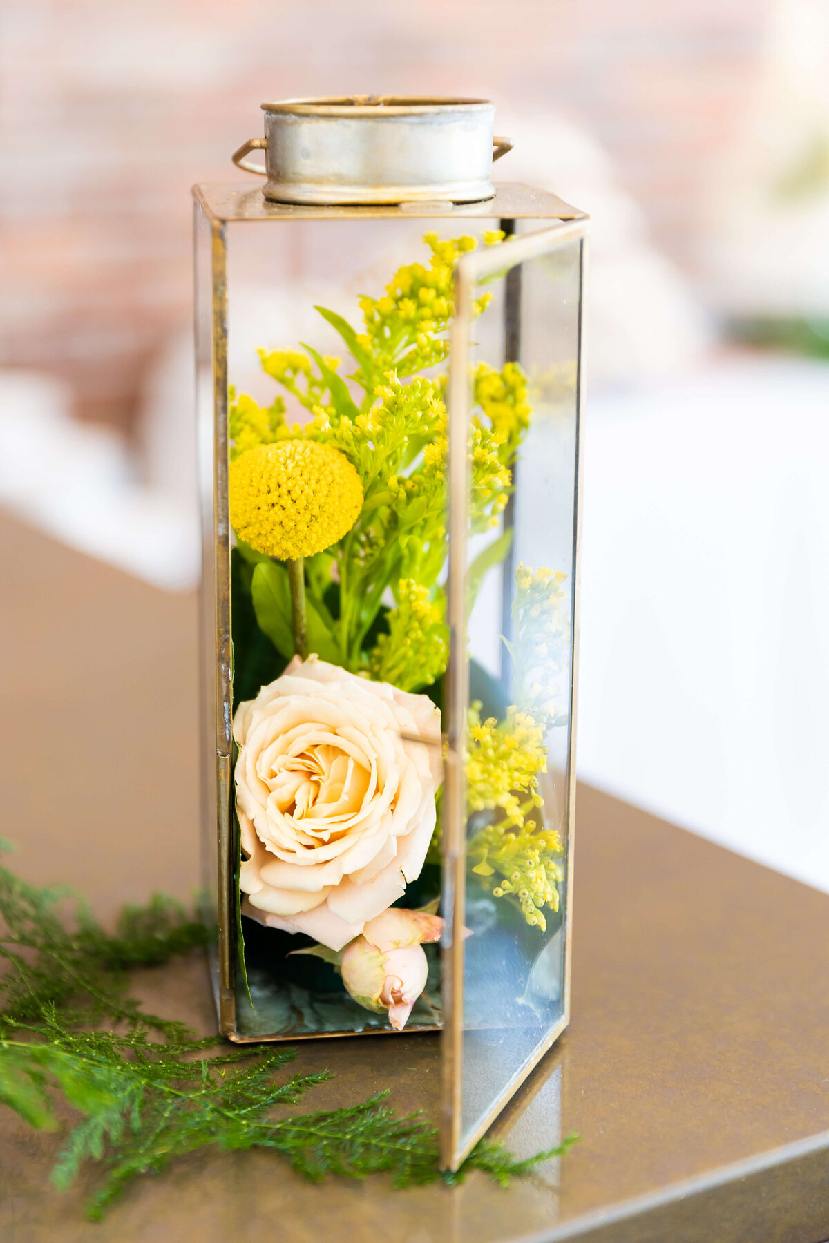 Florals in a glass containter at Fat Bottom Brewery wedding in Nashville, TN