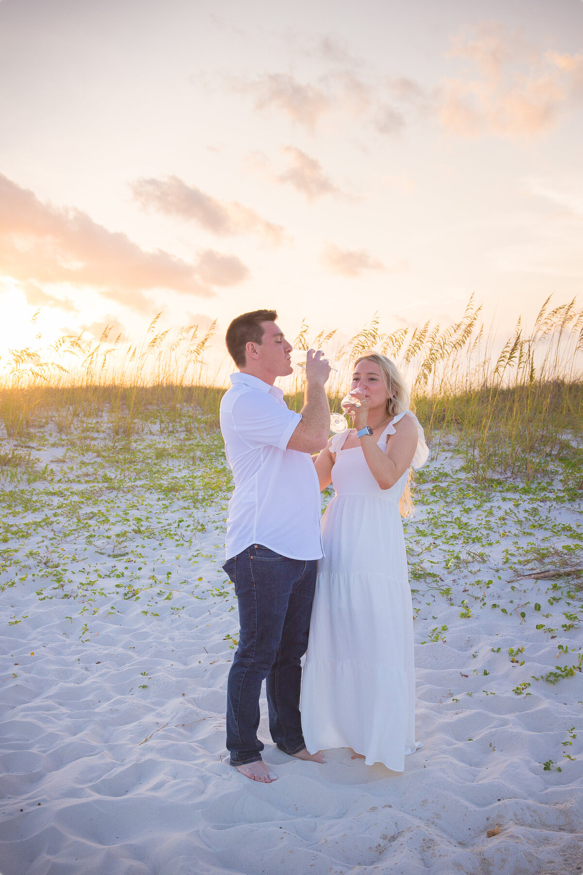 sip of champagne for newly engaged couple