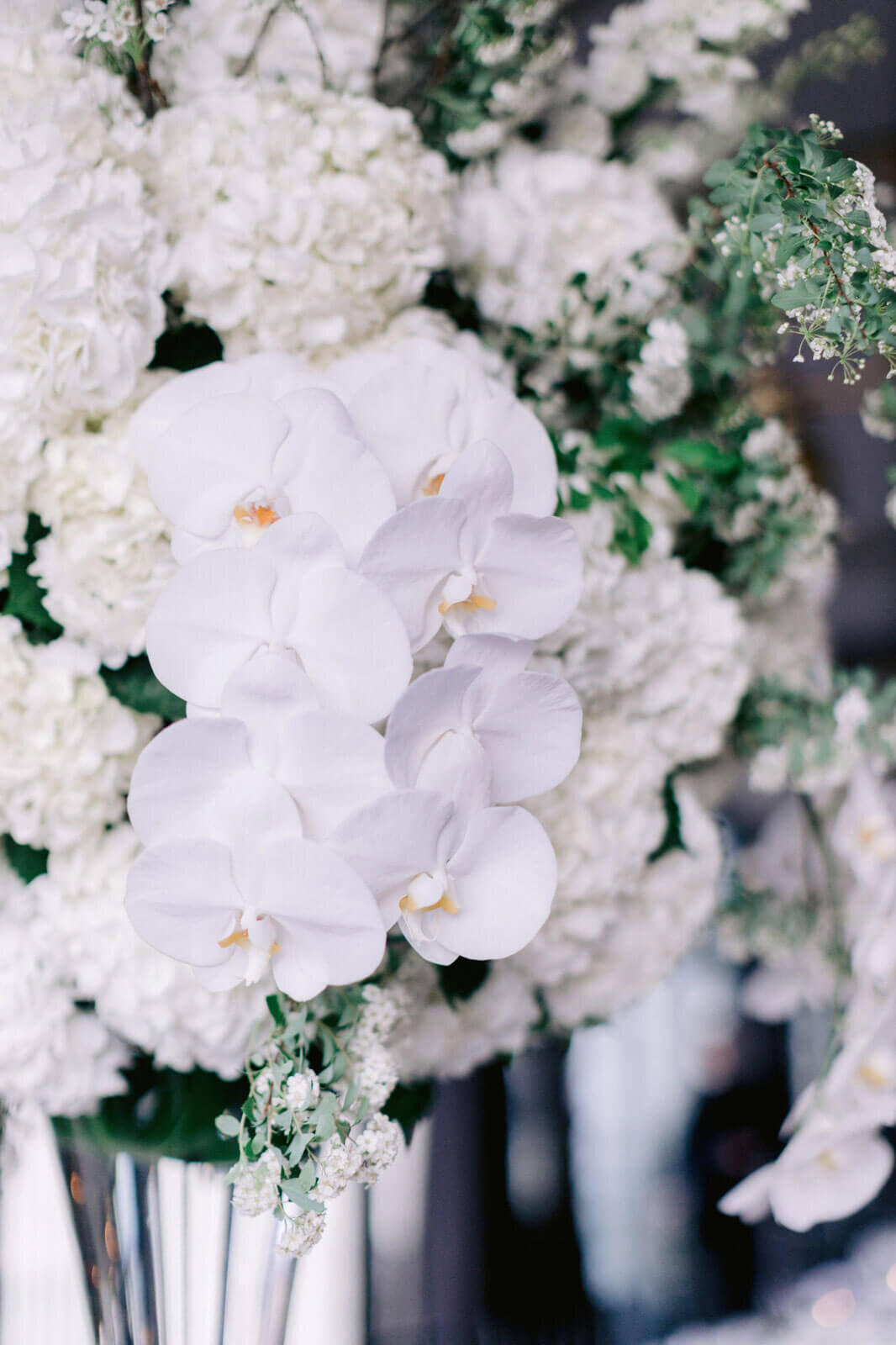 Beautiful white flowers in a vase in The Skylark, New York. Wedding Image by Jenny Fu Studio