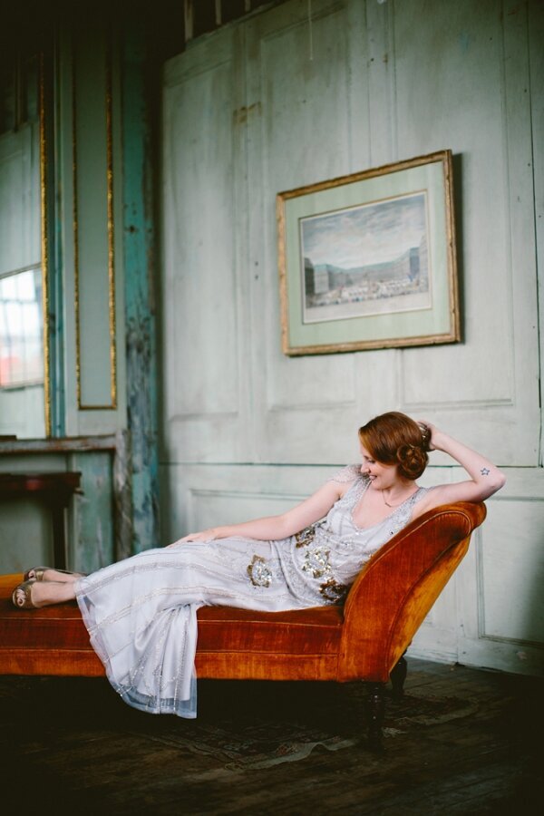 Bride reclines on vintage chaise lounge