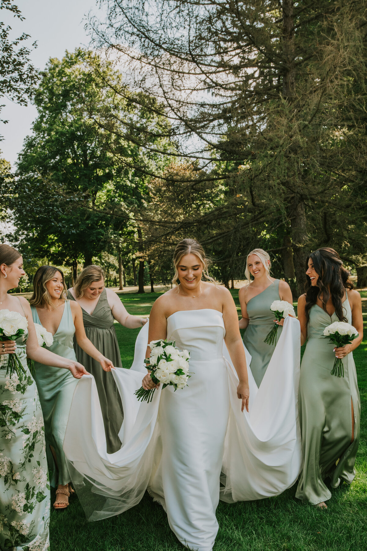 Bridesmaids in a field, outdoor Indiana wedding celebration.