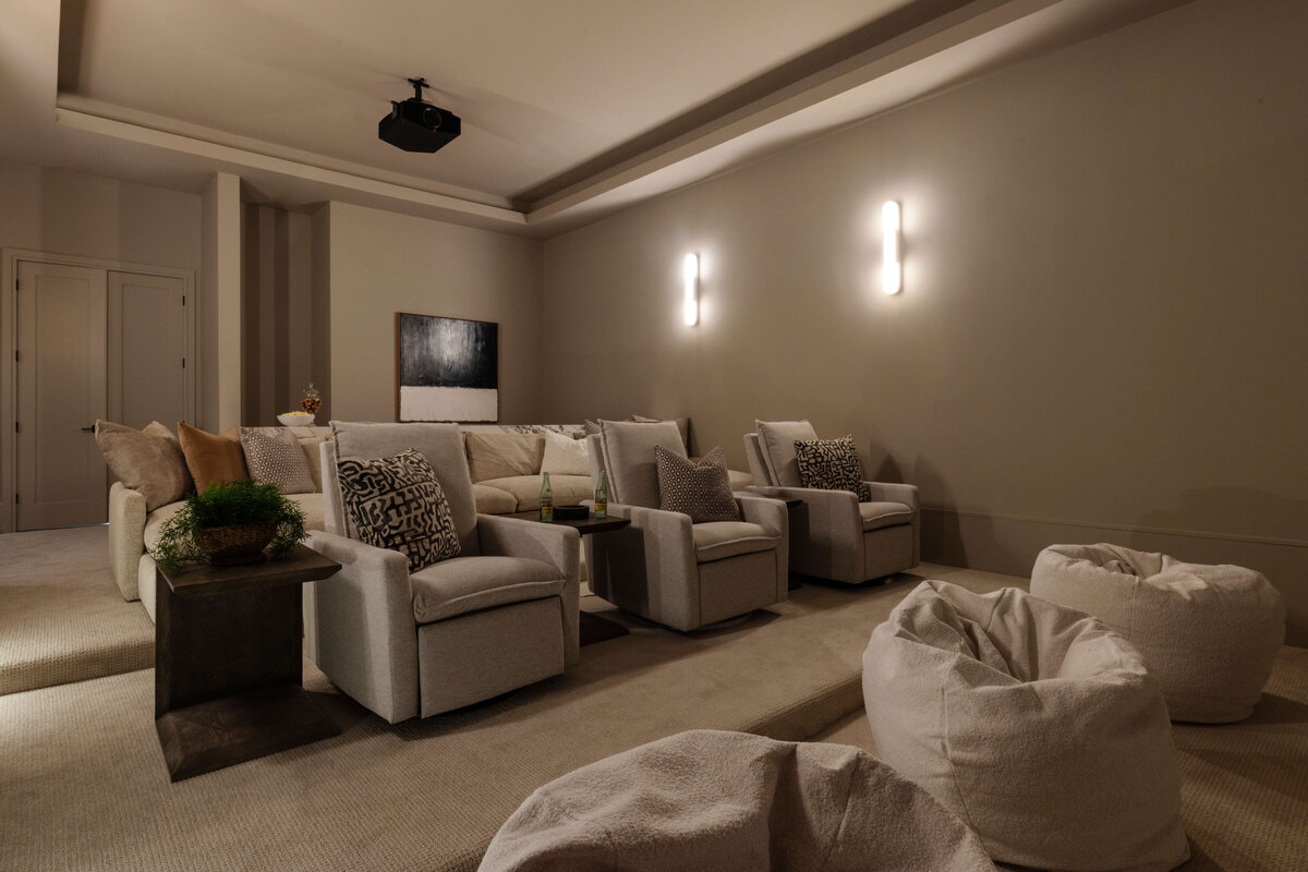 oyster creek studios hughes mood lighting and tan seating in home theatre