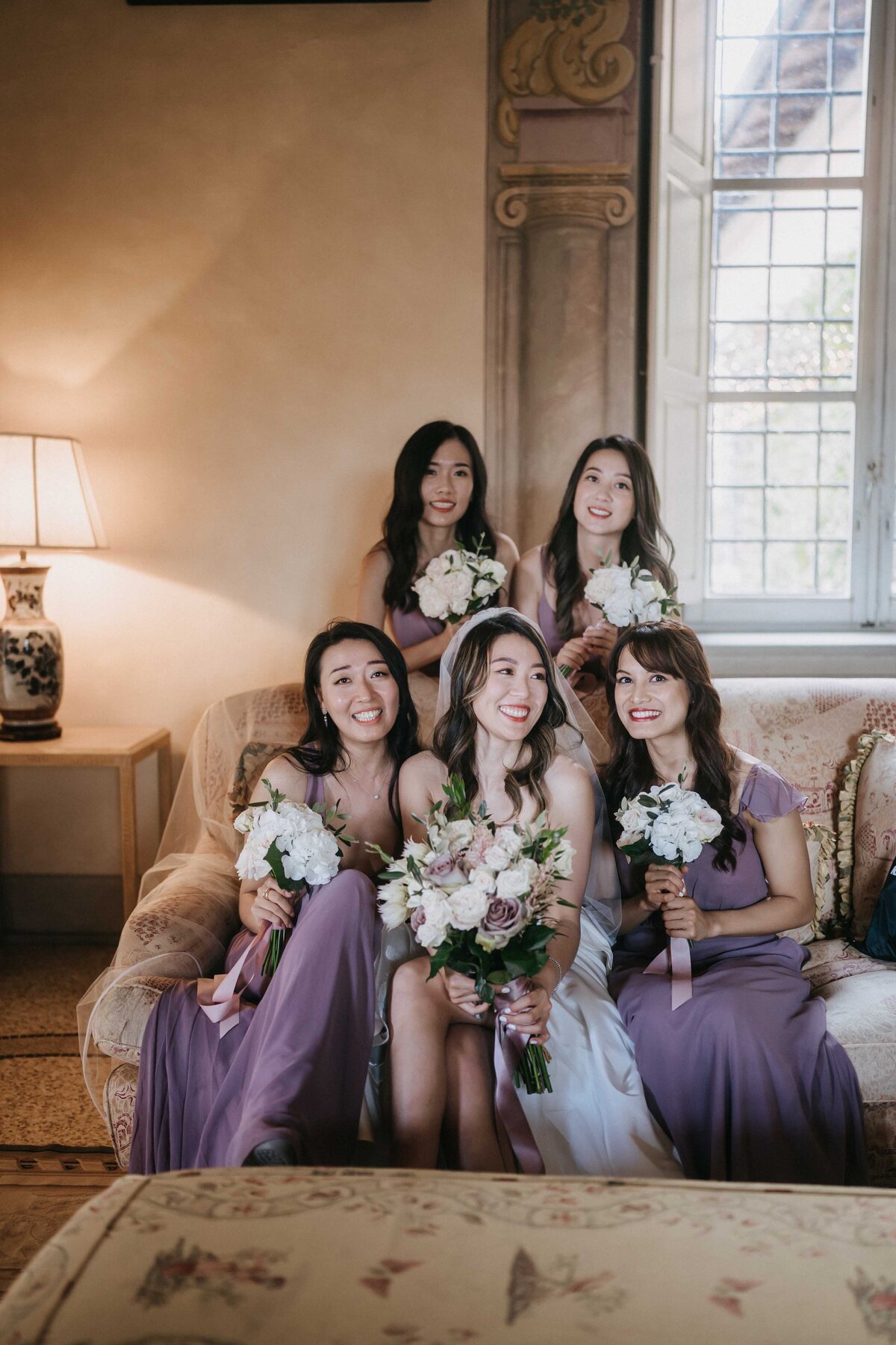 elegant bride and bridesmaid at villa mangiacane