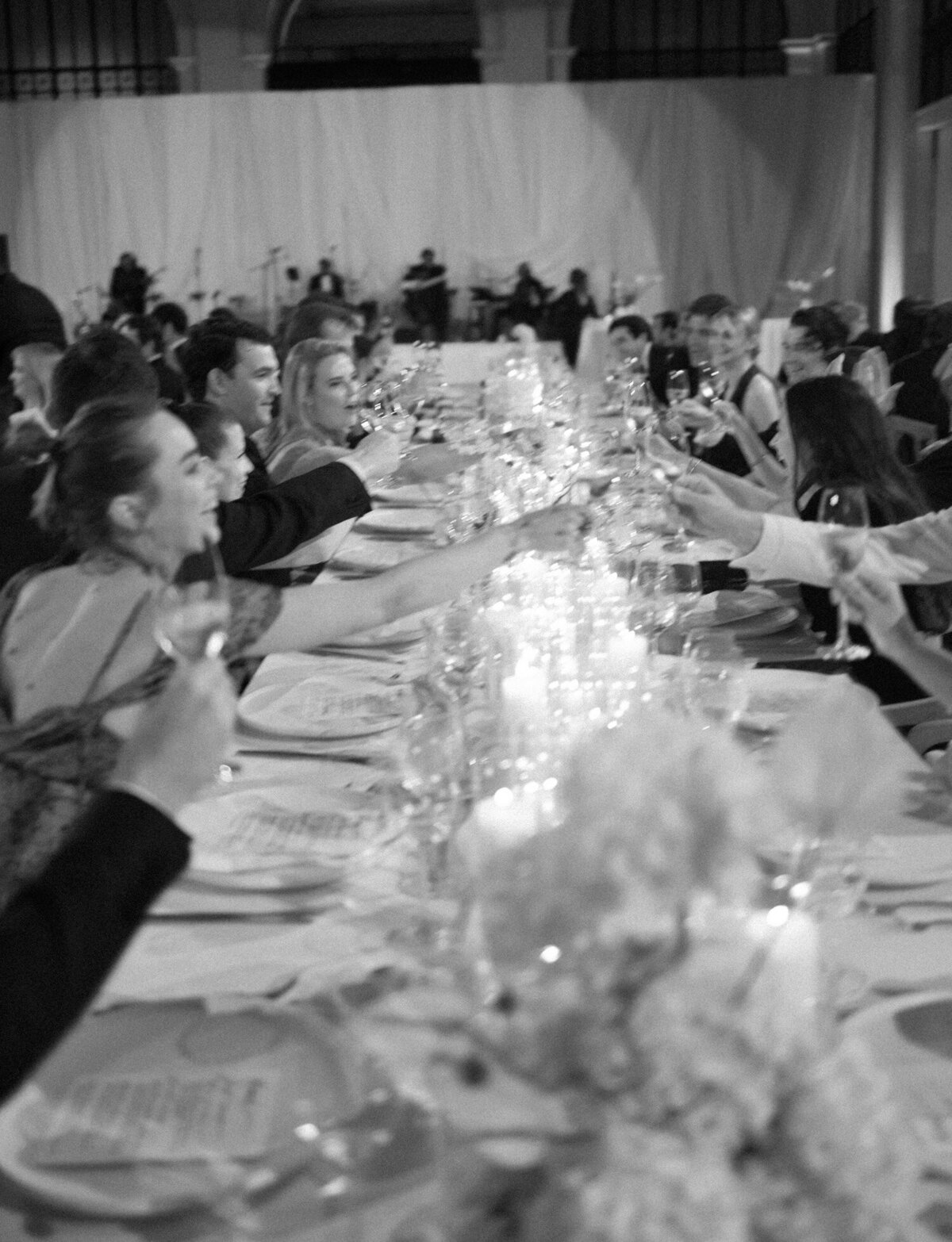 guests toast wine glasses across candlelit tables at State Savings Bank, Detroit