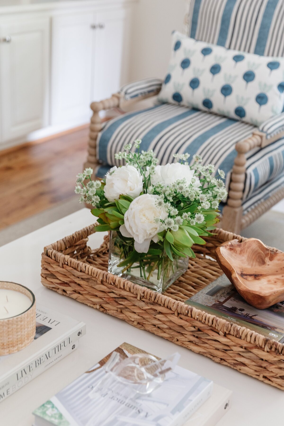oyster creek studios oak forest remodel white coffee table with wicker basket with flowers in living room