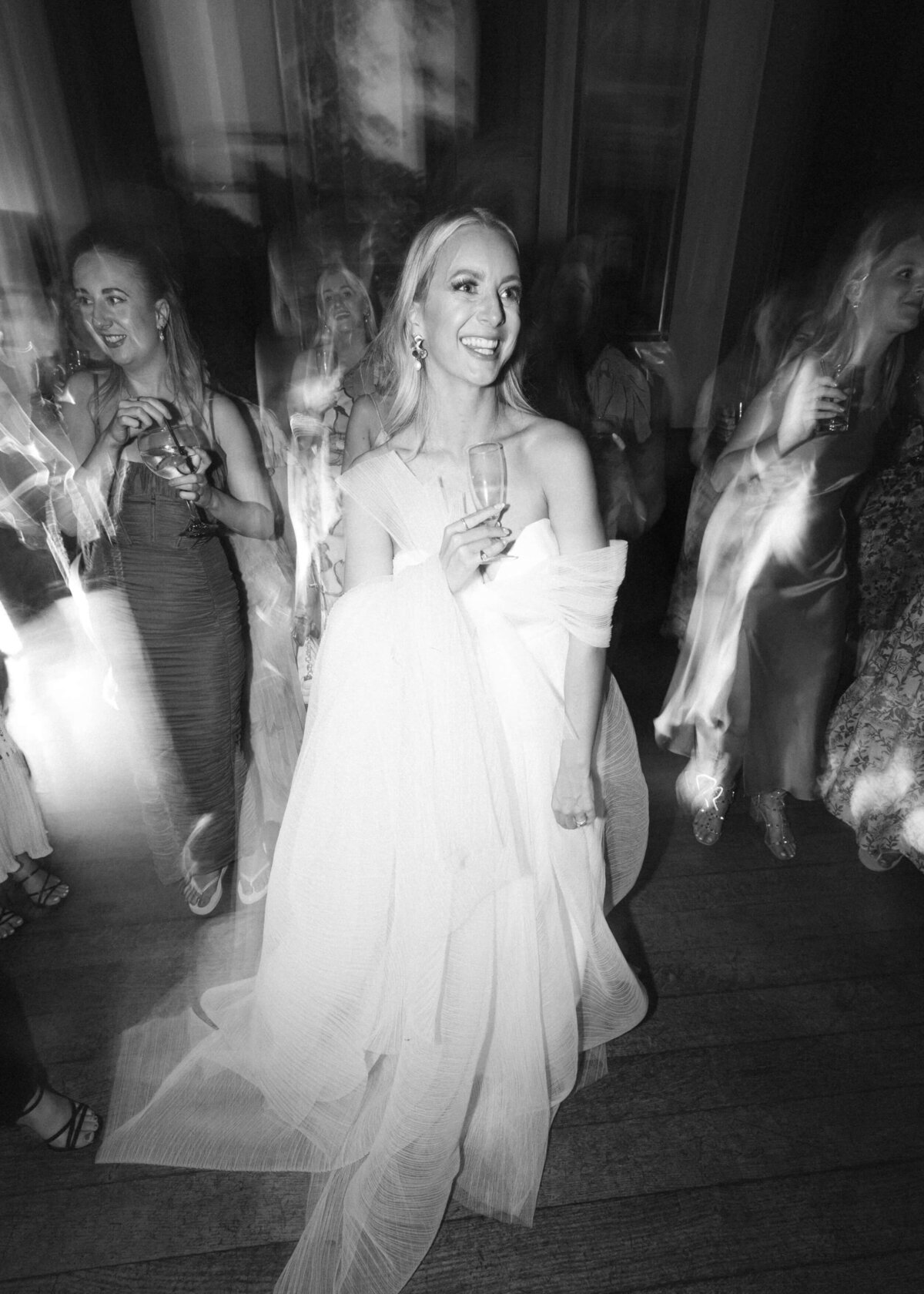 chloe-winstanley-weddings-grittleton-house-bride-dancing-black-white-newhite-bridal