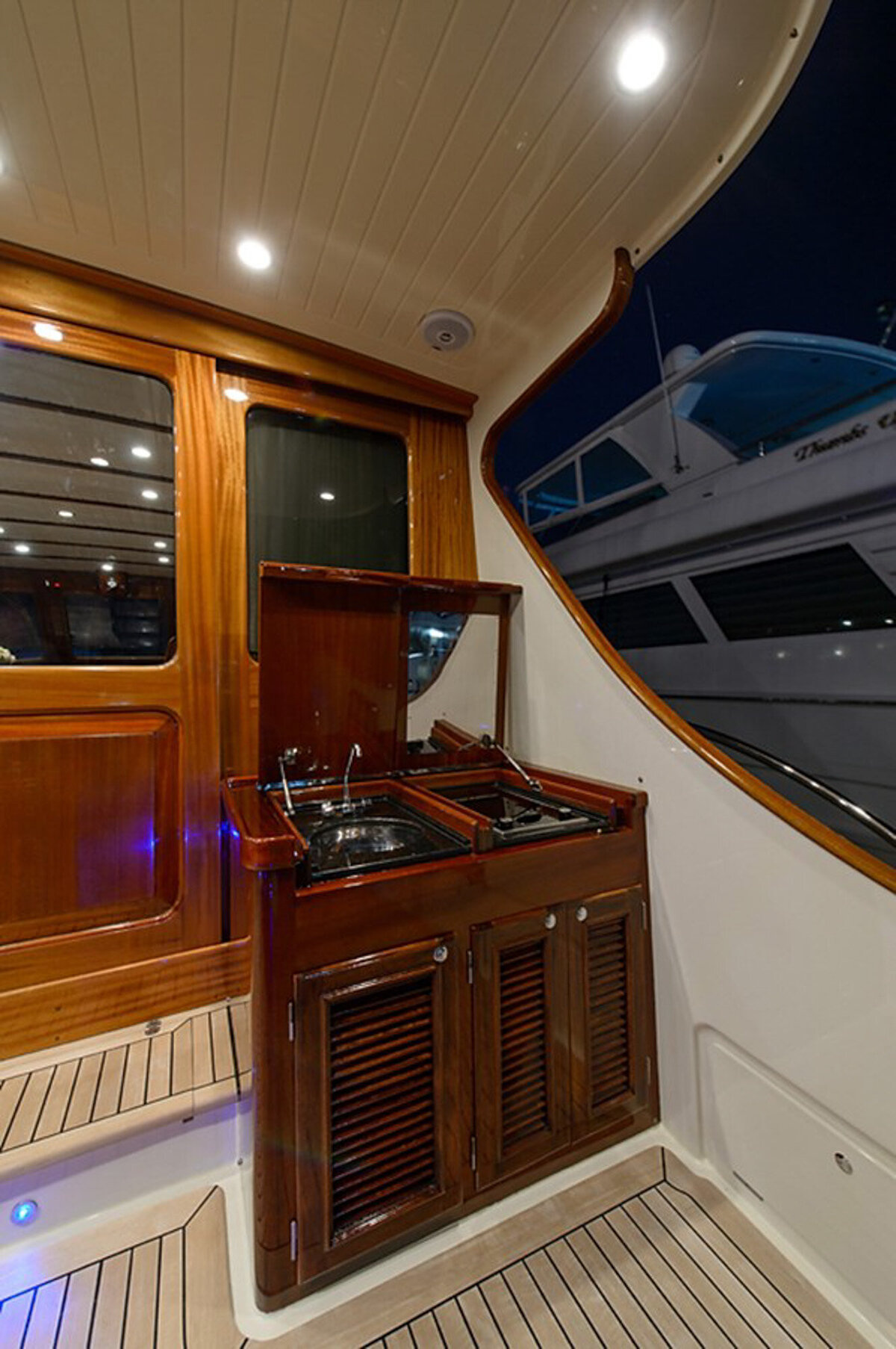 wooden deck of a yacht at night