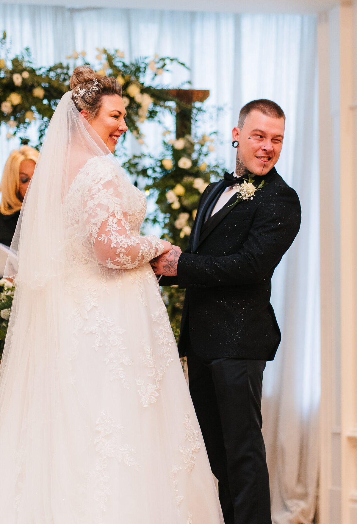 Groom winking at his father during his wedding ceremony takne by Anthony Horseman