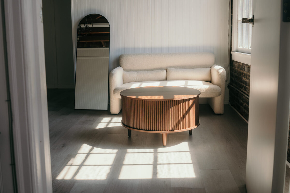 The studio space with beautiful afternoon sunlight shining through the windows on the floor.