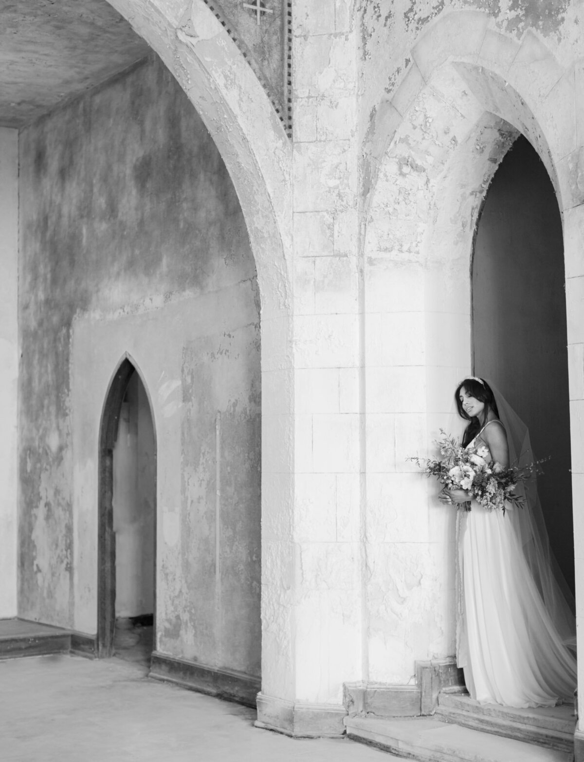 bride under crumbling arches of cathedral ruins, Greece, ruins wedding venue