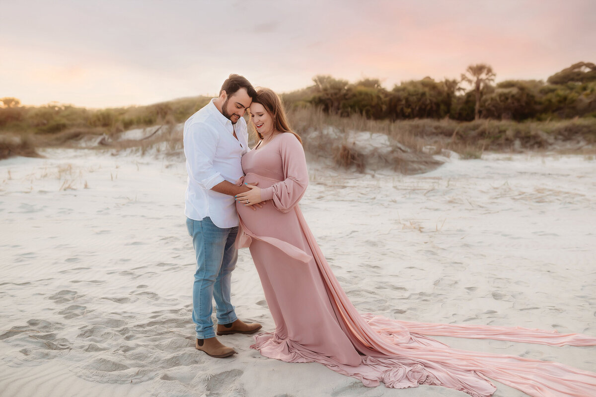 Expectant parents pose for Beach Maternity Photos in Charleston, SC.