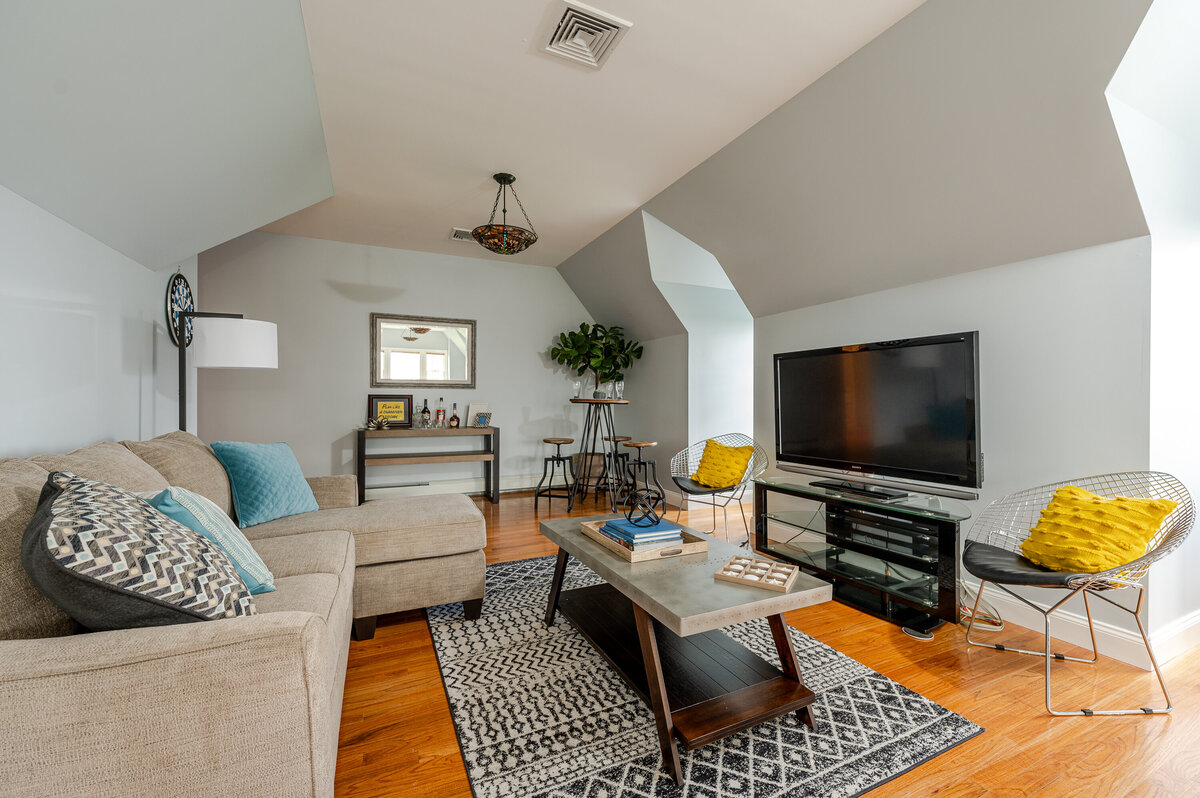 game room with L shaped sofa