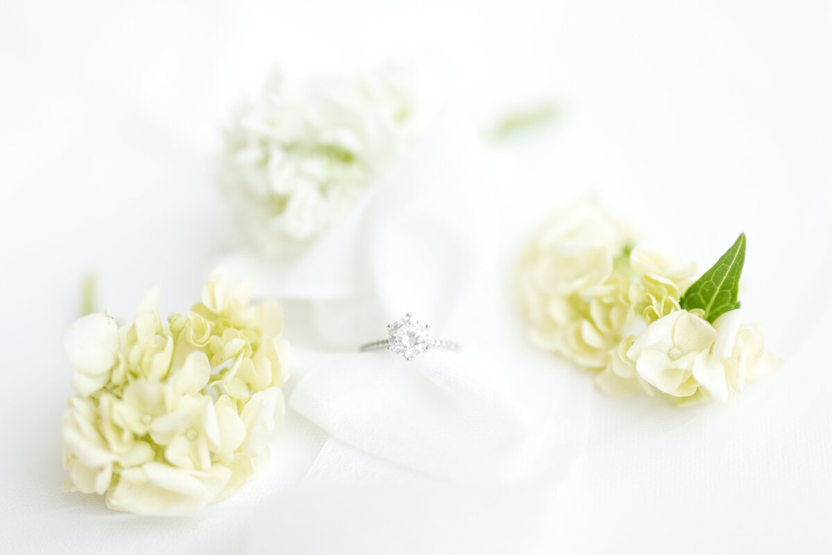 engagement rings in flowers