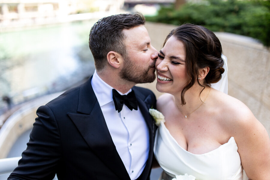 groom-kissing-his-bride-chicago-river