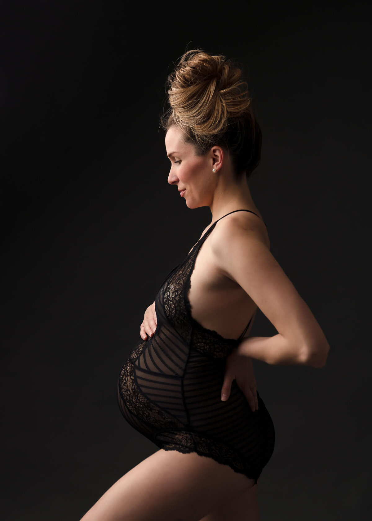portrait of pregnant mom in  lace bodysuit