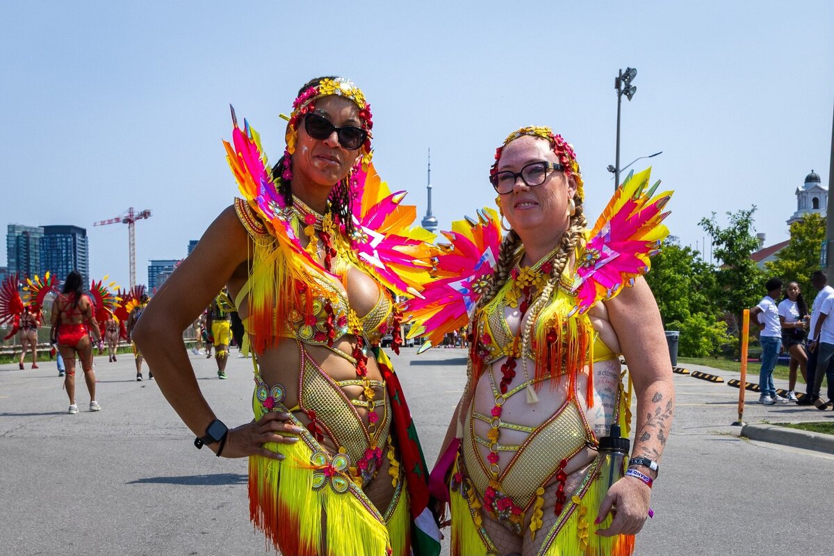 Toronto caribbean carnival parade masquerader in costume with Sunlime Mas, the number 1 medium size band at Toronto Carnival.