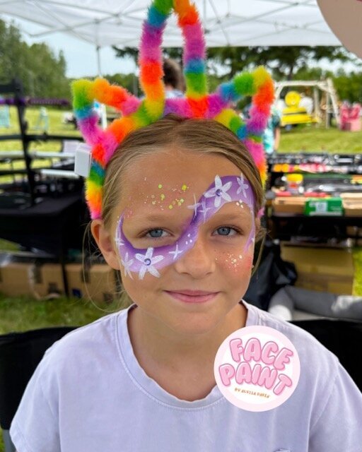 face-painting-by-alyssa-daken-Bemidji-cute-girls-purple-flowers-swirl-face-paint-design