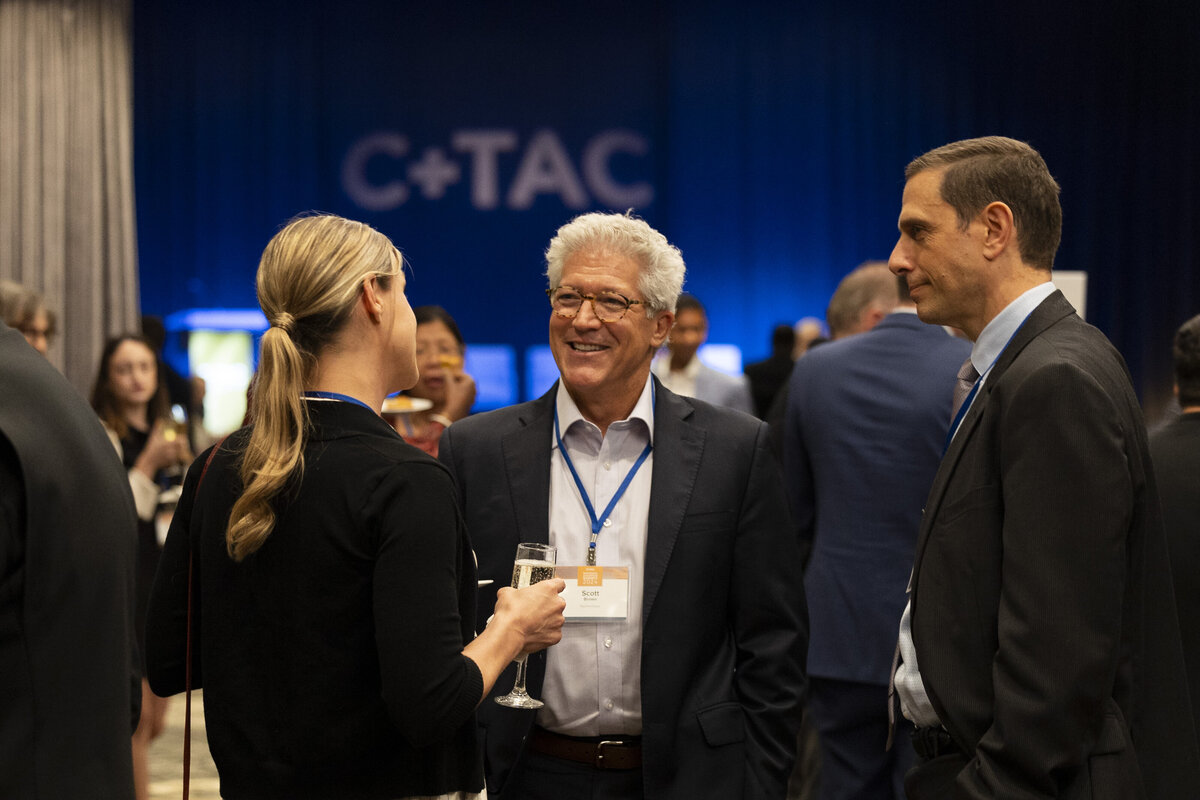 People talk at an event in DC.