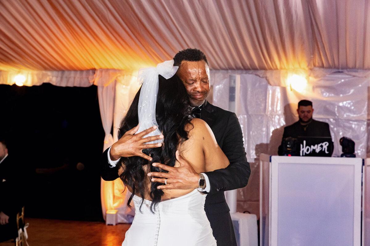 Shannon Lee, from Love Like Wild Photography, captures a heartfelt father-daughter dance at the wedding reception.
