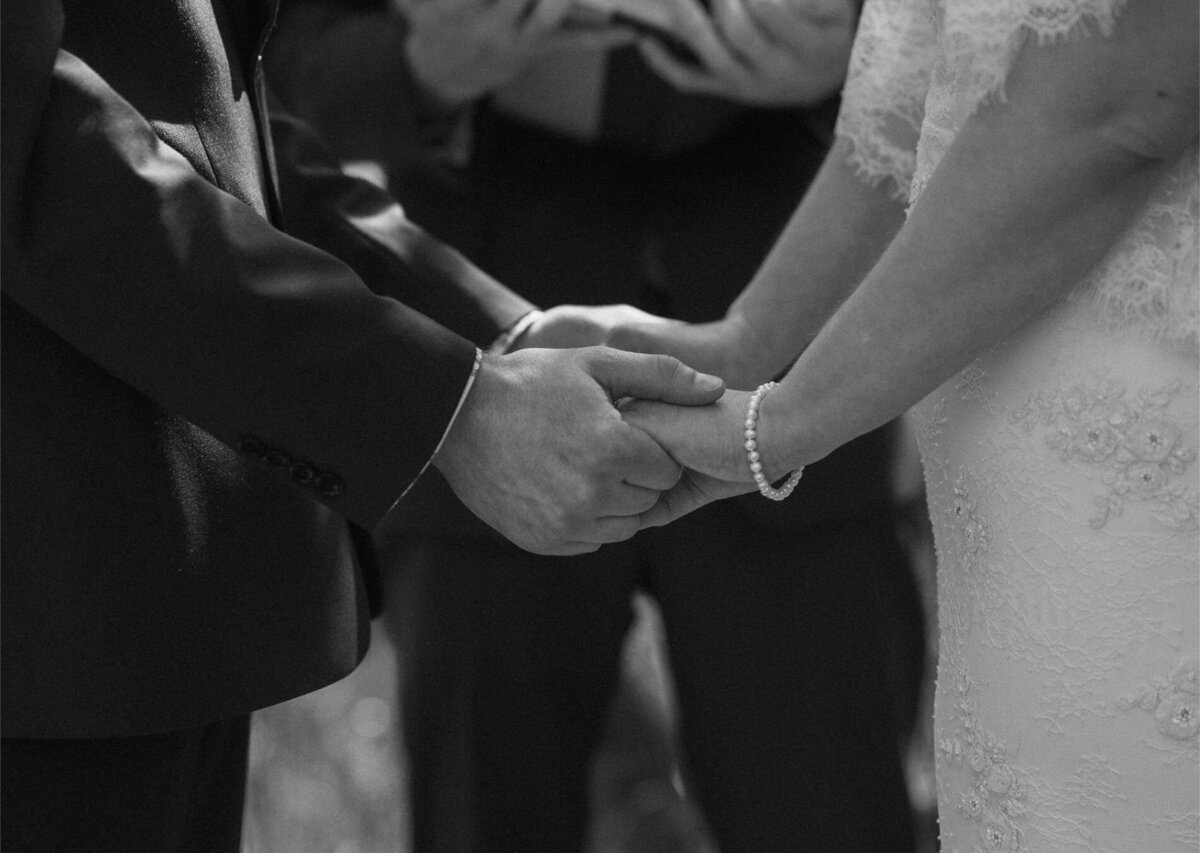 bride and groom hold hands during their intimate and emotional elopement in Bend, OR