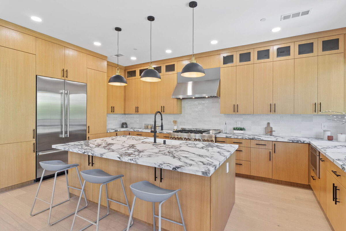 bright-white-kitchen-with-large-island-and-natural-light