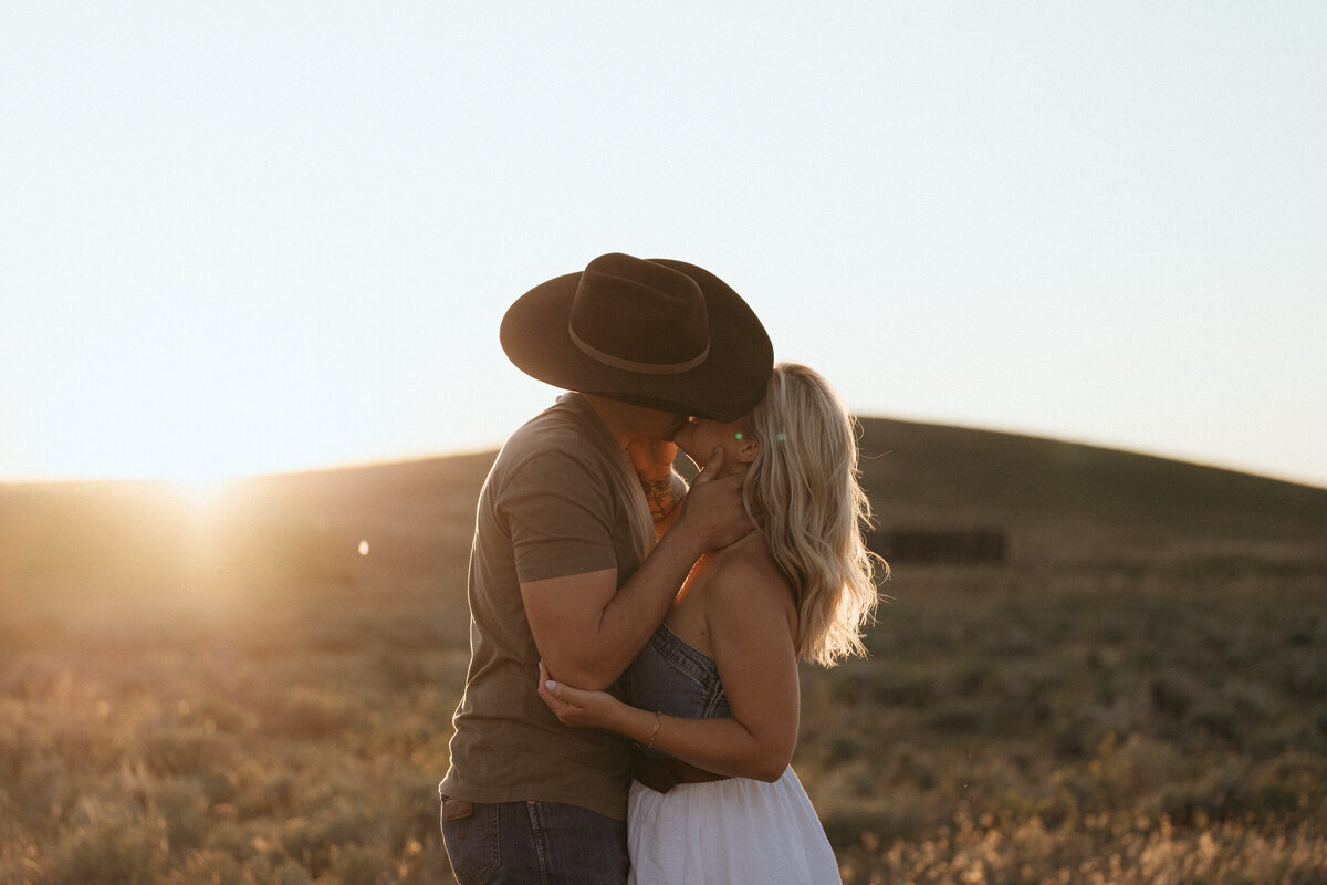 Couple during golden hour engagement shoot in  Idaho wedding/elopement - photographed by The Storytellers