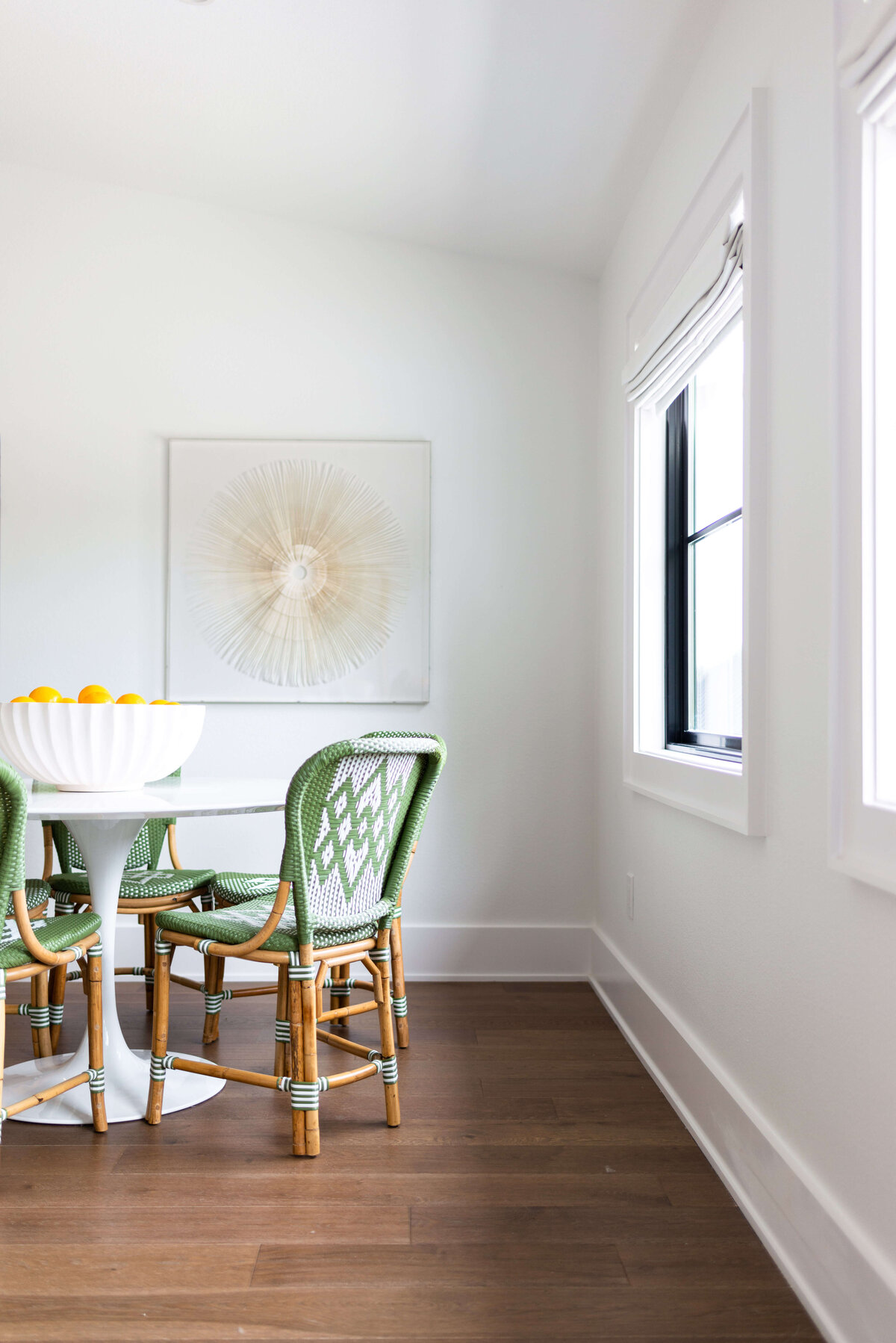 oyster creek studios building belt new build  green wooden chairs around white table in dining area