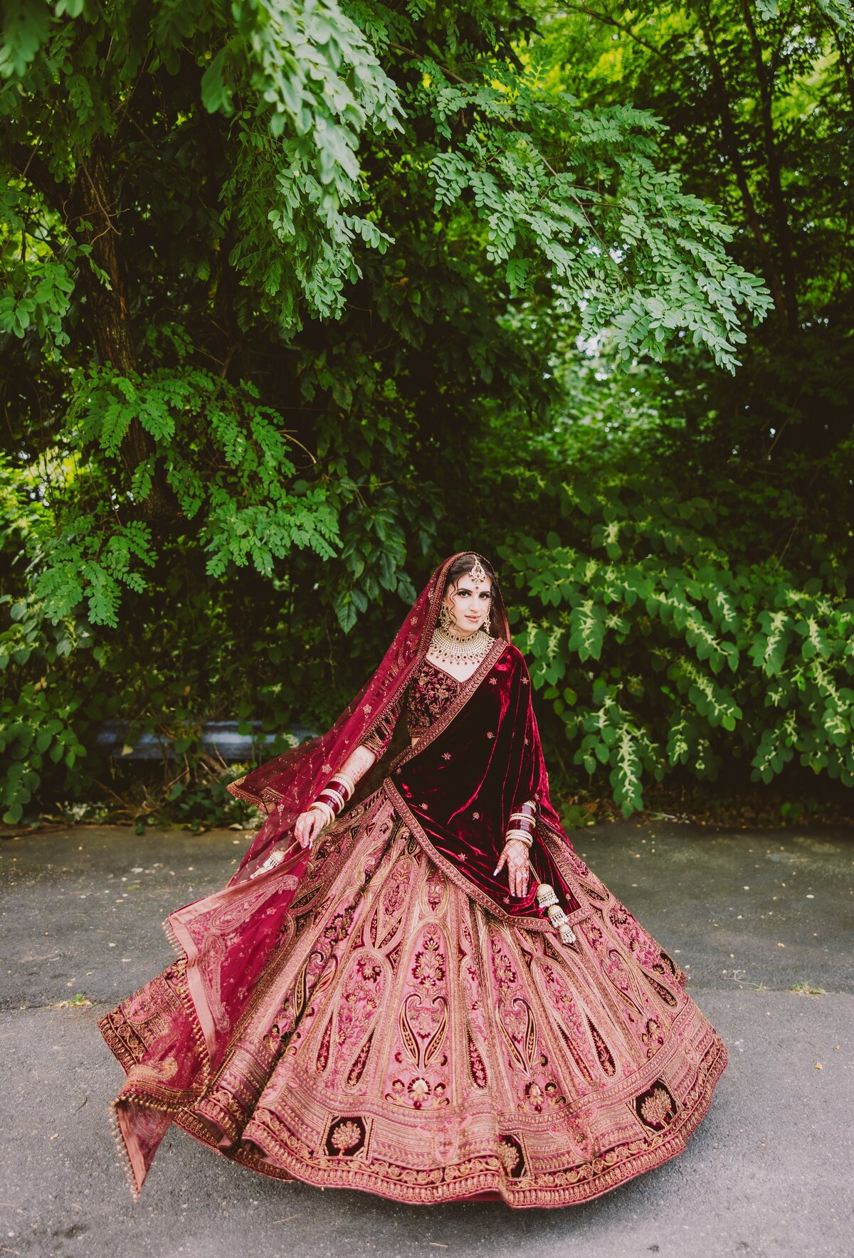 Indian sikh bride twirling outside before the anand karaj ceremony