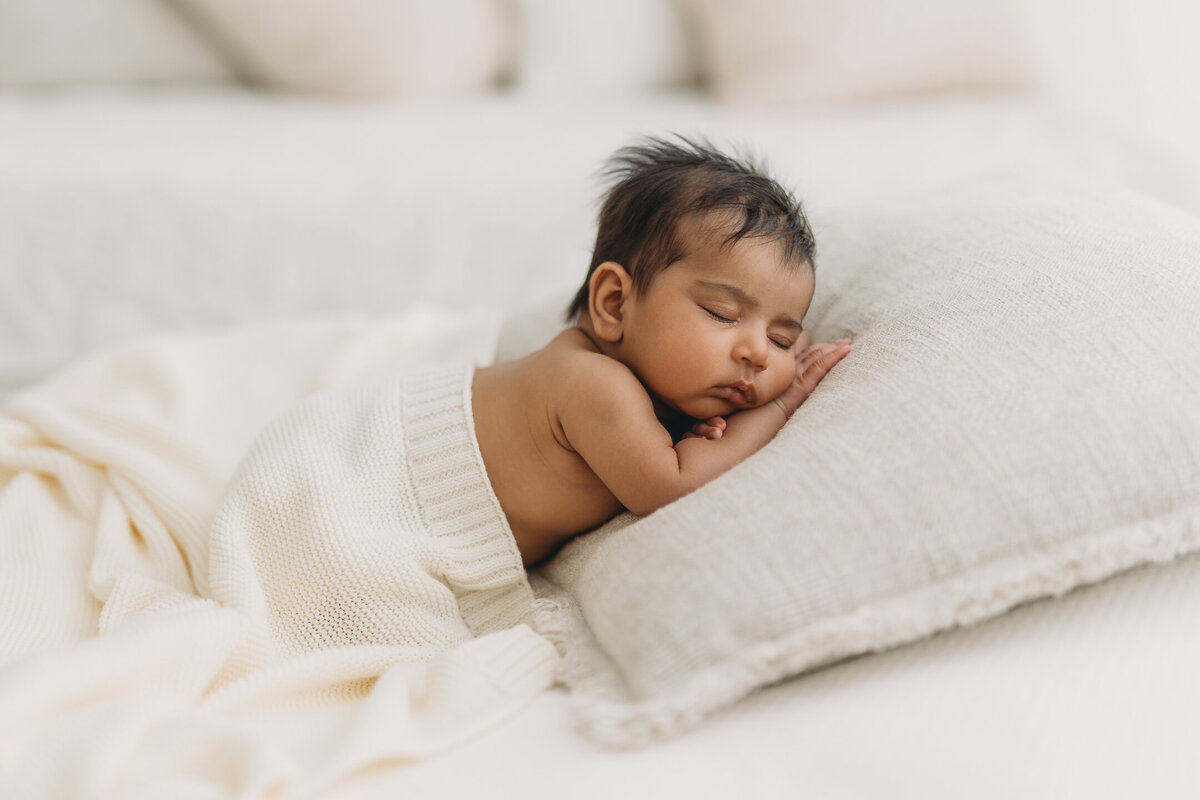 baby sleeping on a pillow