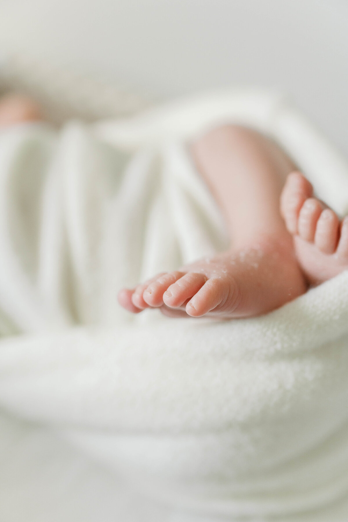 Baby toes in a swaddle in Virginia Beach newborn session.