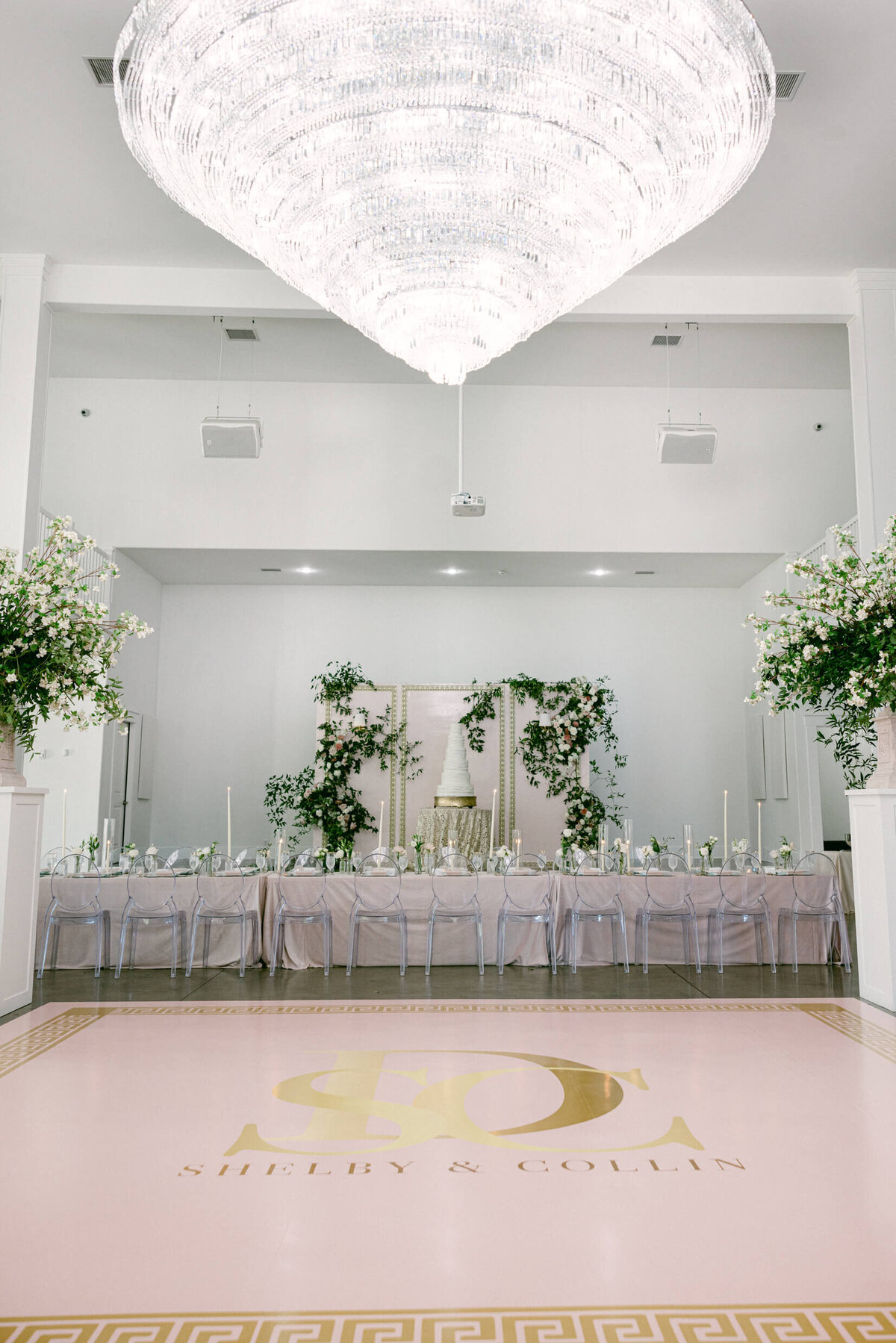 A wedding photo of the reception space showing off  florals and decorations