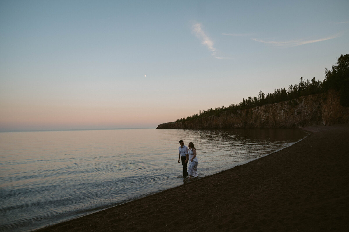 couple stroll on the beach