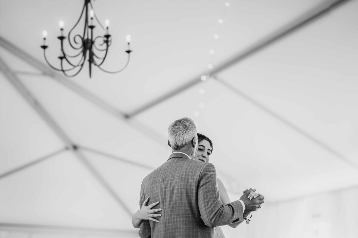 father and daughter dance with the ceiling as the backdrop at the Rust Manor House