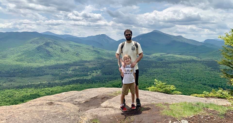Son and step dad on top of a mountain in Lake Placid