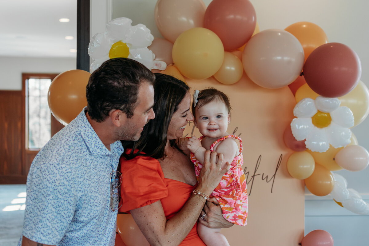 First birthday love for a sweet girl with her mom and dad during a photoshoot in Hinsdale, IL