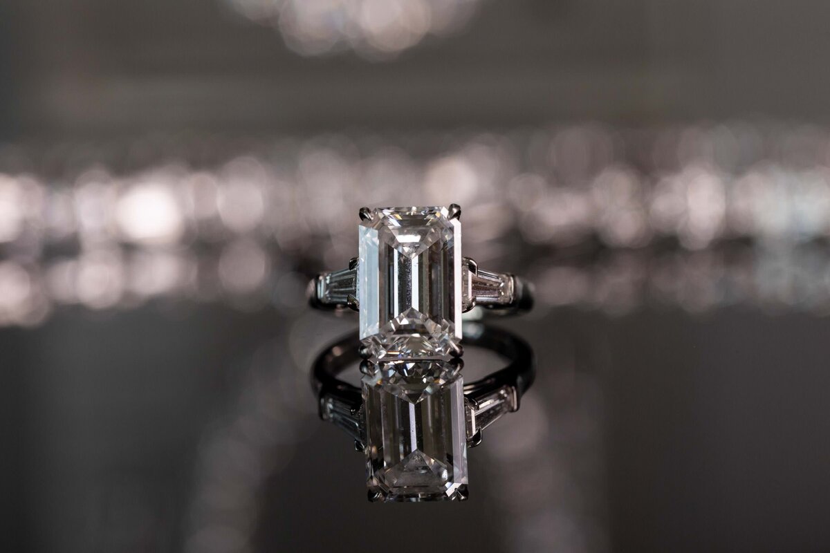 an engagement ring sitting on a table