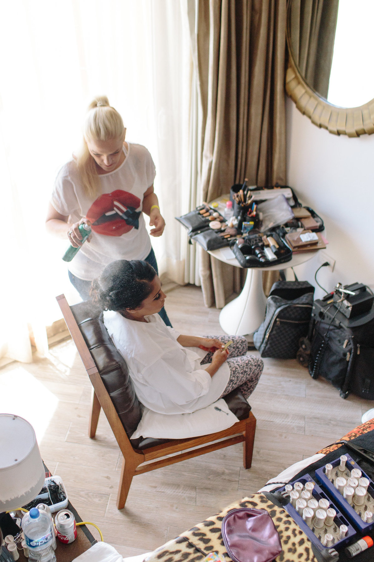 Destination bride getting hair perfected.  Photo by Rebecca Cerasani.