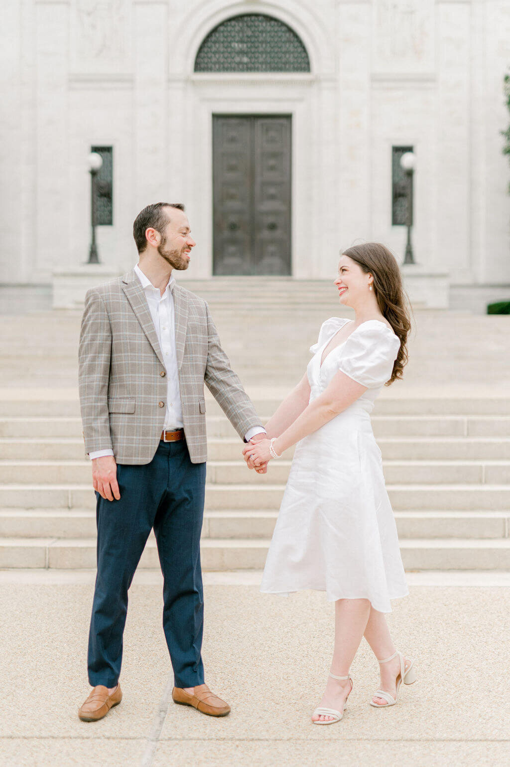 Wedding Engagement photos of couple holding hands by Rachael Mattio Photography