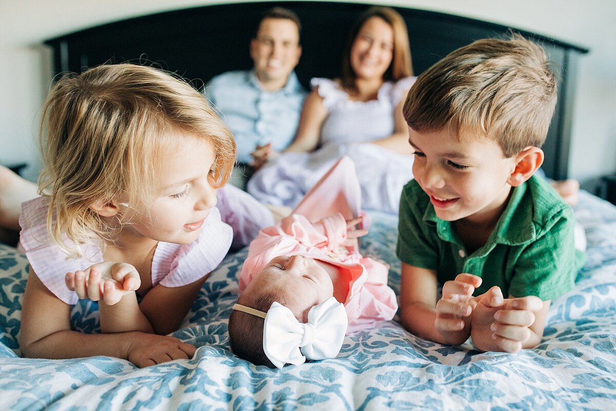 in home lifestyle family photo with newborn