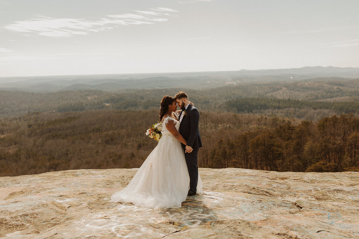 Bride and groom embrace at Bald Rock SC